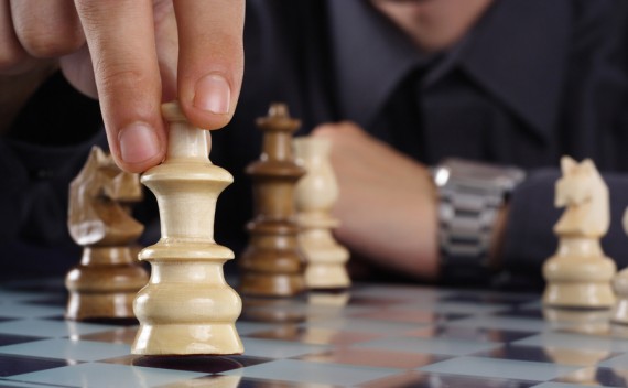 Businessman playing chess